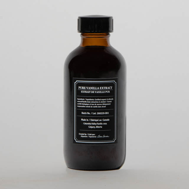 Bottle of pure vanilla extract on a gray background