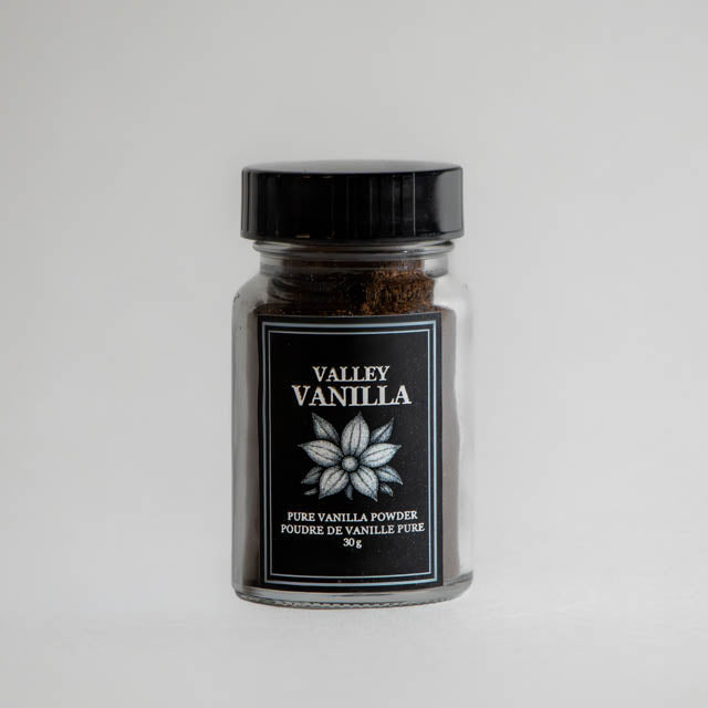 Jar of Valley Vanilla pure vanilla powder on a white background