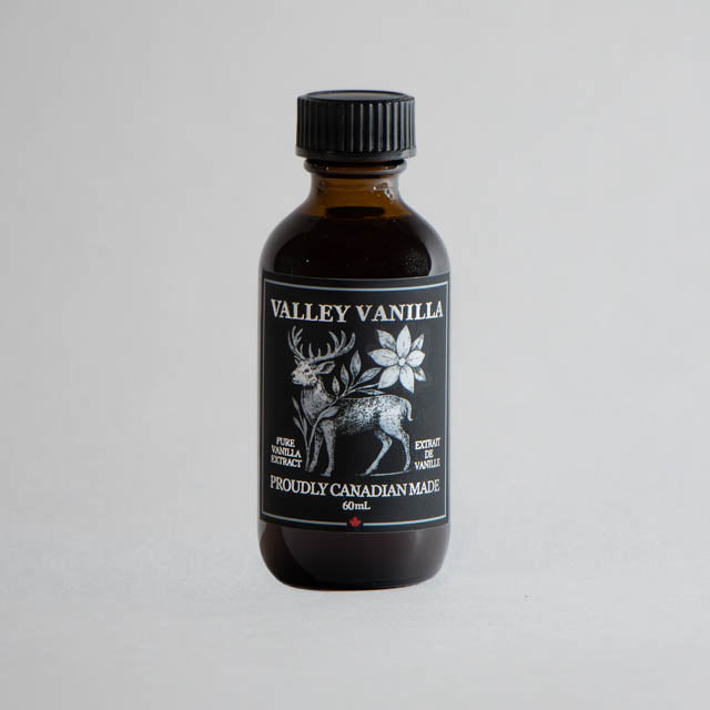 Bottle of Valley Vanilla extract on a gray background